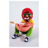 Rastafigur neben Baumstamm und Joint in der Hand